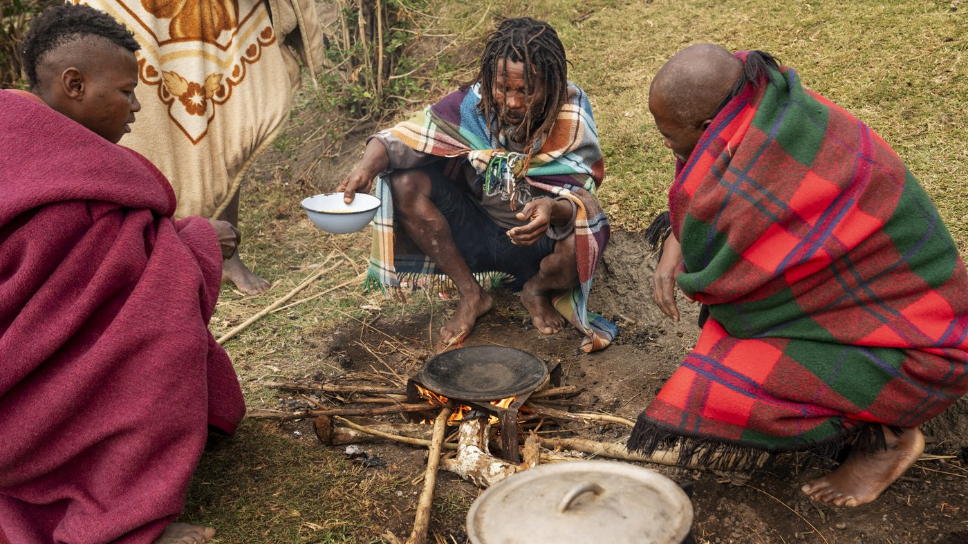 Maasai elders cooking over an open fire